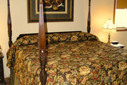 Chocolate brown drapery with quilted valance that includes braided trim and tassel. Includes a roller shade for privacy
