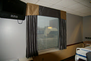 Beautiful faux silk drapery help the hospital room feel more like home. 
