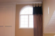 The 17 ft. silk drapes help join the upper and lower windows in this two story living room.
